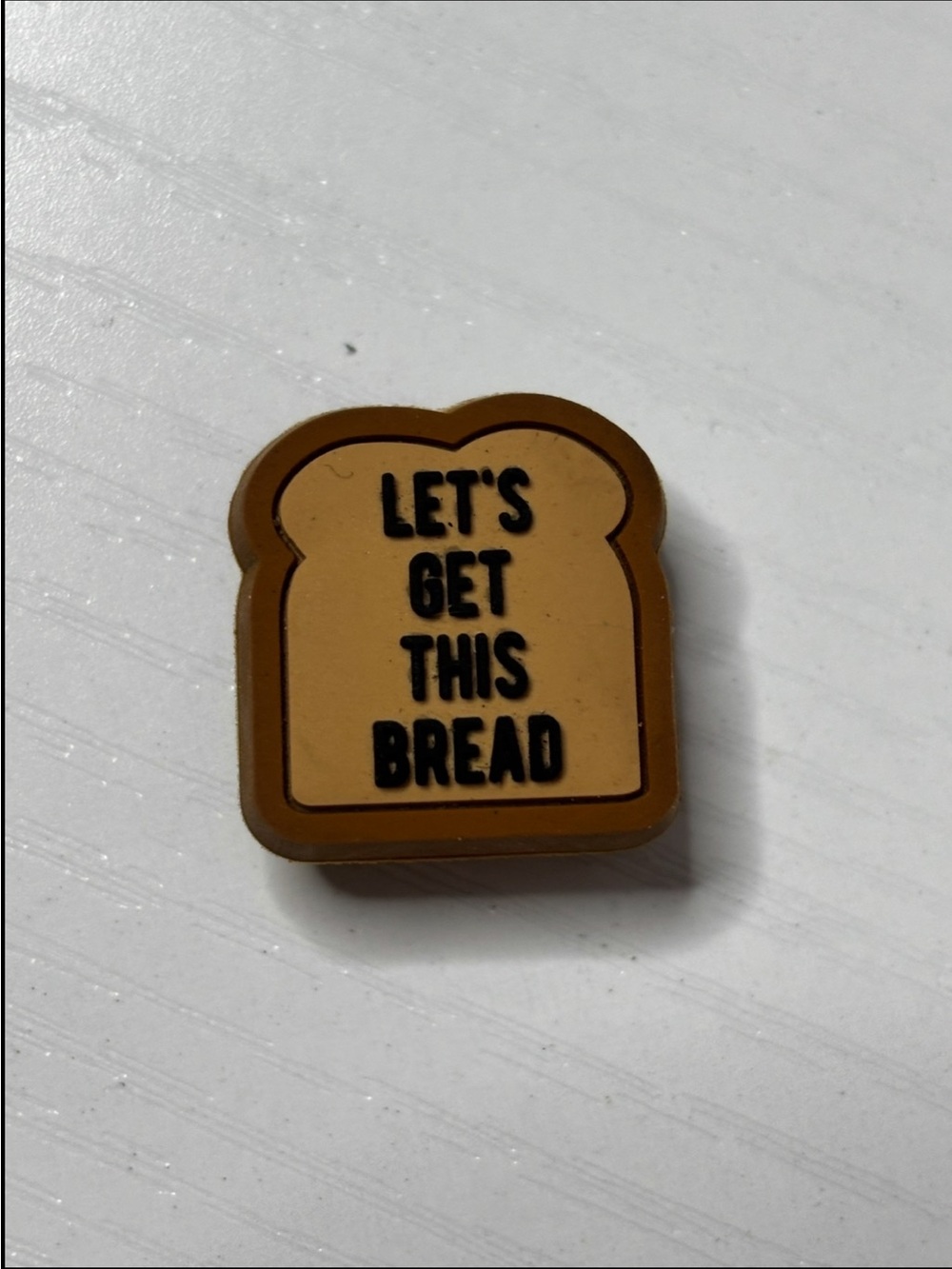 CROCS Jibbitz “Let’s get this bread” Charm in Tan and Brown with Black Text